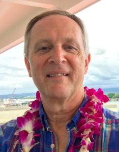 Joe wearing a lei after landing in Hilo, Hawai'i